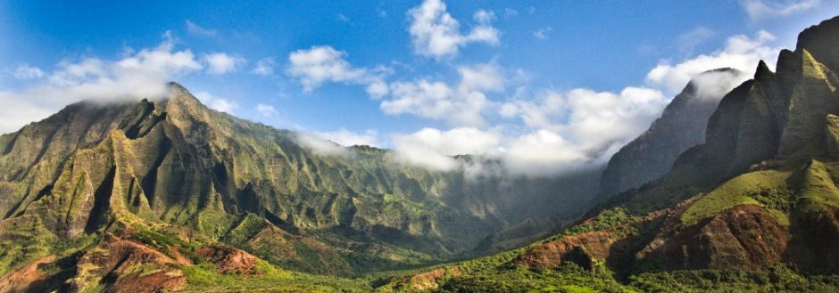 bright-green-mountains-and-blue-waters-on-kauai-beach