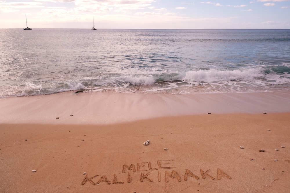 Mele Kalikimaka written in sand
