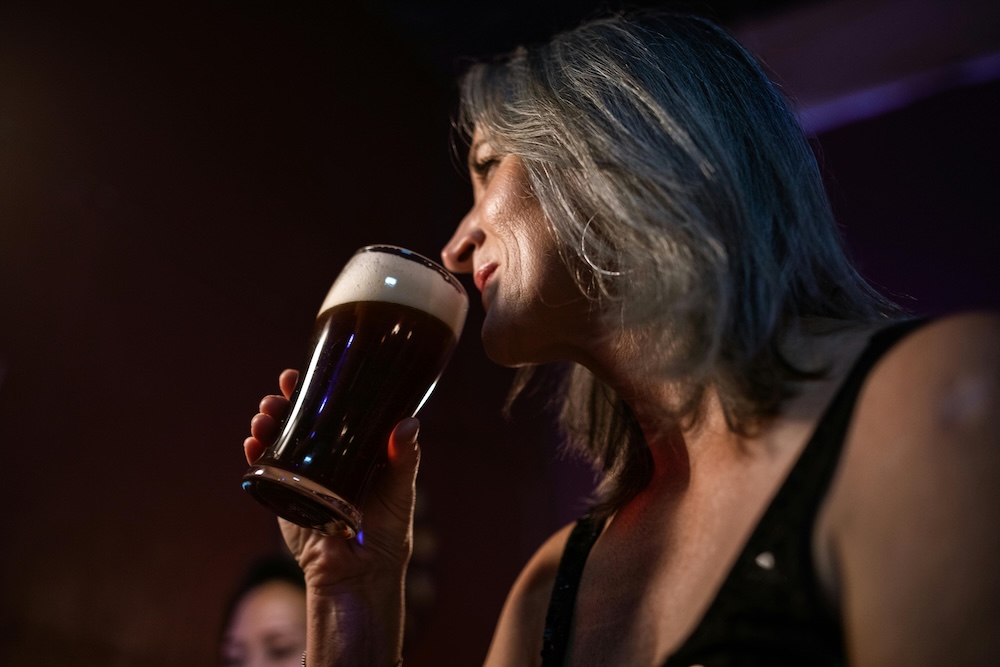 Woman enjoying a beer in Kauai, Hawaii Woman enjoying a beer in Kauai, Hawaii